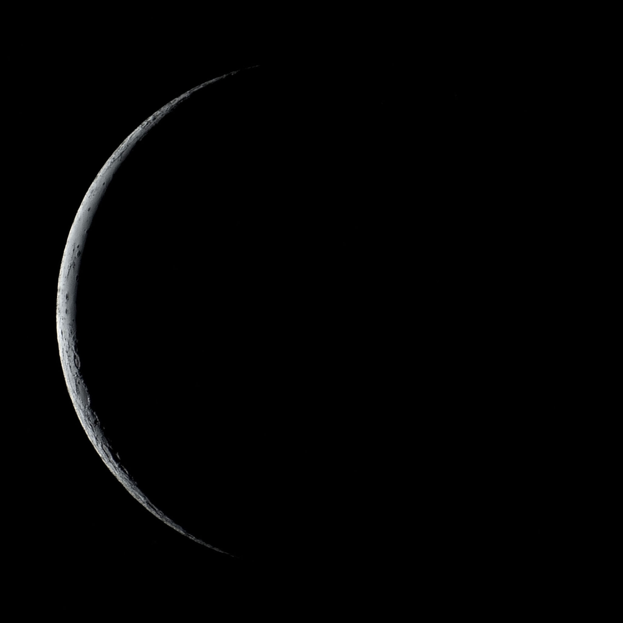 A waning crescent moon is seen in the sky